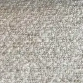Beige textured rug with heathered and speckled appearance, dense irregular weave, and nubby surface suggesting a natural wool or blend fiber.