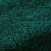 Rugiano rug, teal green indoor fabric, irregular textured surface with mottled, organic arrangement and subtle tonal variations.