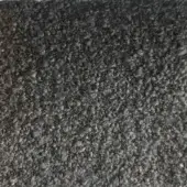 Dark gray rug with dense looped fibers, likely wool or blend, displaying a consistent charcoal tone and plush, textured pile throughout.