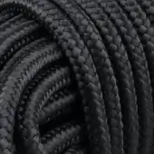 Black rope rug, Rugiano Outdoor collection, tightly coiled with intricate braiding and a durable, textured synthetic material.