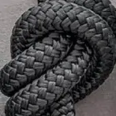 Grey rope rug with dense knotted texture and grid pattern, showcasing a cylindrical weave and rounded sculptural form against a neutral backdrop.