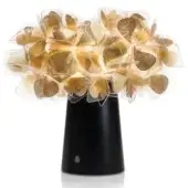 Slamp Clizia lamp, dark gray conical base, gold translucent leaf canopy, warm LED glow, organic tree-like structure, studio shot.