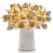 Slamp Clizia lamp, matte white base, gold translucent leaves forming a conical canopy, studio product shot.
