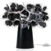 Slamp Clizia table lamp, black polycarbonate, conical base with overlapping translucent grey and black petal canopy, matte finish.