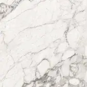 Porcelain stoneware texture, white and off-white veined pattern, irregular stone chunks with gray and brown fissures.