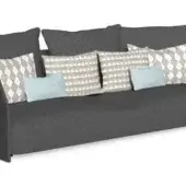 Gray fabric sofa with wide curved armrests, featuring solid and patterned pillows, low rectangular base, studio lighting.