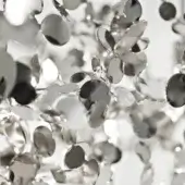 Terzani argent chandelier, stainless steel, layered discs and leaf forms create a reflective, sculptural lighting fixture.