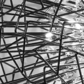 Terzani Core chandelier, black nickel plated clear glass, spherical cage framework with intersecting rods and reflective polished finish.