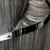 Terzani Epoque belt in black nickel-plated metal, featuring a wide rectangular buckle and polished reflective surface on textured fabric.