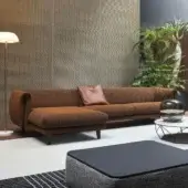 Distinguished Bonaldo Saddle sectional with reddish-brown textured textile and darker brown leather accents built on sleek metal legs