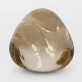 Champagne crystal sculpture, translucent amber tone, freeform rounded shape with polished finish and internal swirling patterns.