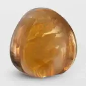 Terzani Mizu sculpture, cognac crystal, organic rounded form with polished surface reflecting diffused light and tonal variations.