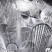 Terzani Moire pendant lamp, nickel-plated metal, features layered wave-like strips and circular openings for diffused light.