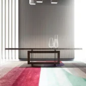 Exceptional Costantini Pietro Blade table with a satin medium-dark brown wood tabletop and dark metal rectangular base