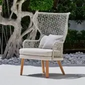 Exceptional Varaschin Emma Bergere lounge chair with woven backrest and armrests in beige fabric with Iroko wood frame