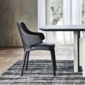 Sophisticated Cattelan Italia Wanda armchair fully upholstered in smooth matte black leather with tapered legs