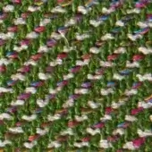 Woven zigzag fabric texture features green, white, pink, blue, and gold hues with a dense, slightly nubby, subtly sheened surface.