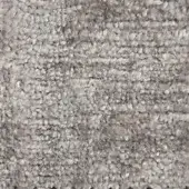 Woven fabric texture, muted gray color, dense looped pile with horizontal ridges, matte finish, substantial weight, handcrafted quality.