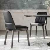 Distinguished Cattelan Italia Belinda chair crafted with natural ash wood and smooth matte dark leather with a satin finish