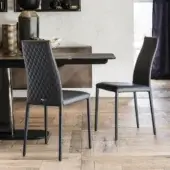 Distinctive Cattelan Italia Kay Couture chair fully upholstered in quilted synthetic material with sleek steel legs