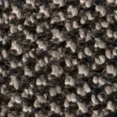 Woven tweed texture with charcoal gray and beige yarns forming a dense, irregular pattern and slightly raised, nubby surface.