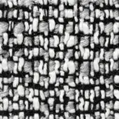 Woven tweed fabric with black, white, and gray vertical lines and irregular yarn blocks, displaying a nubby texture and visible grid weave.