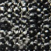 Dark gray fabric texture with interwoven silver threads, displaying a tightly woven, slightly raised, and subtly reflective surface.