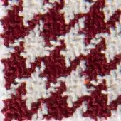 Burgundy and white looped knit yarn texture features a checkerboard pattern with a dense, repeating square grid and soft, fuzzy surface.