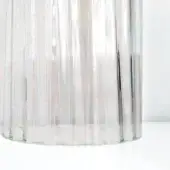 Vistosi Armon CRRV vase, clear glass, vertical ridged texture, cylindrical shape, slightly irregular base, studio lighting.