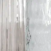 Transparent plastic film sheets display folded textures, one with vertical striations and the other a dense, diamond-patterned network of wrinkles.