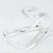Vistosi Gioga center table, clear glass, organic looping form with molded base, internal striations, and textured surface.