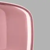 Pink molded plastic chair with rounded rectangular backrest and light pink trim, studio shot against a gray background.