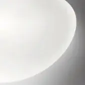 White circular lampshade, smooth material, rounded edge against gradient gray backdrop, diffused lighting, minimalist studio composition.