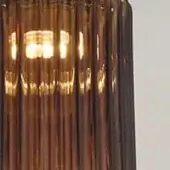 Amber ribbed glass lampshade, cylindrical shape, Vistosi Tread TBTR collection, glossy finish, internal light source visible.
