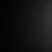 Matte black texture with granular surface and diffused light, displaying subtle tonal variations and a consistent monochromatic palette.