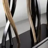 Console table, black marble top, with curved gold and black metal legs featuring an intertwined, sweeping design and polished finish.