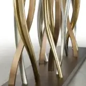Console table, bronze and nickel finish, with curved metal base and dark brown plinth, partially visible glass top.