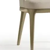 Bizzotto Dune Chair, bronzo antico finish, features a light beige upholstered seat and curved legs, studio shot on white background.