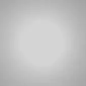 Gray gradient background transitioning from dark to light gray, smooth uniform surface, subtle tonal shift, diffused effect, digital rendering.