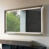 Sophisticated Reflex Prisma mirror with extra-clear glass, bright white lacquered glass frame and integrated perimeter lighting