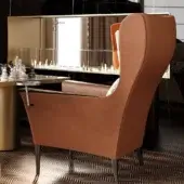 Distinguished Reflex Bergère lounge chair with wood and polyurethane structure, reddish-brown textile upholstery, plus satin dark brass metal base