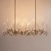 Superior Il Pezzo Mancante Il Pezzo 3 chandelier crafted in hand-forged brass with a satin gold finish and clear solid crystal illumination