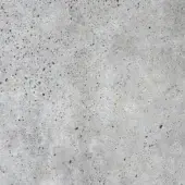 Natural cement texture displaying a mottled gray surface with granular details, small dark spots, and a matte, porous finish.