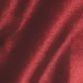 Brilliant Velour fabric VE16, deep red, dense pile with directional sheen creating diagonal stripes and a plush, granular texture.
