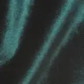 Textured teal and charcoal surface with vertical streaks, granular velvet-like texture, diffused lighting, and subtle tonal variations.
