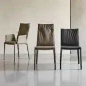 Distinguished Cattelan Italia Isabel chair with dark leather upholstery, light cushioning and slender exposed steel legs