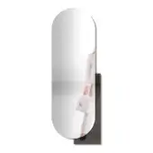 Oval mirror with dark gray metal bracket, showing blurred reflection of person with handbag, featuring smoked glass detail.