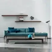 Elegant Sovet Italia Slim sofa with teal European fabric upholstery and a dark-toned wooden frame