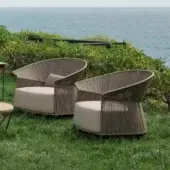 Sophisticated Potocco Ola lounge chair with hand-woven gray-brown ribbon backrest and plush light beige polyurethane foam cushion