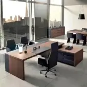 Superior 4 Mariani Kefa desk built with brown wood, soft leather inlay, and titanium aluminum drawer pulls in matte lacquer